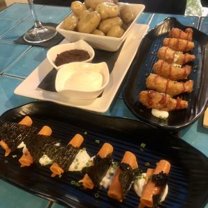 Patatas bravas, shrimp and smoked salmon with caviar.  at Chez Kessler in Barcelona