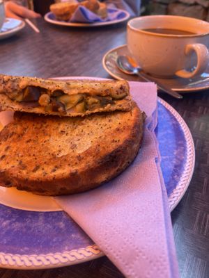 Hummus and roasted veggies toastie with americano  at St Mocha in Balmaha