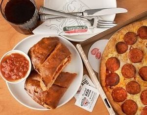 Vegan Pepperoni calzone /pizza ( comes with crushed pepper vegan marinara and peperonchini! at Sarpino's Pizzeria in Palatine