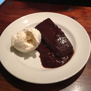 vegan orange chocolate cake with vegan ice cream!  at GoKula Vegetarian Cafe in Watford