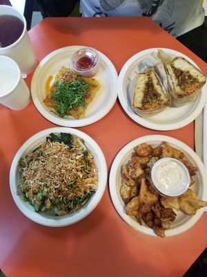 Our four dishes, two mains, two sides at Fat Choy in New York City