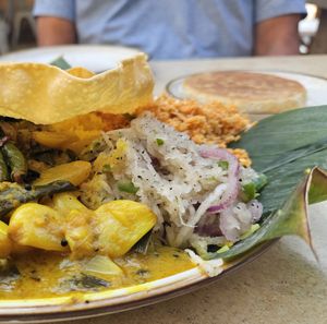 Today's Plate: Braised Garlic, Shallot Dynamite, Pol Sambal, topped with Pampadam & served with Pol Roti at Mirisata in Portland