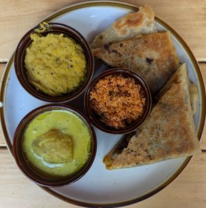 Chick'n & Cheese Roti Combo Plate with potato curry, dahl, and pol sambol at Mirisata in Portland