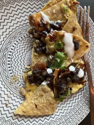 The loaded nachos were 🔥  at PLANTA Cocina in Toronto