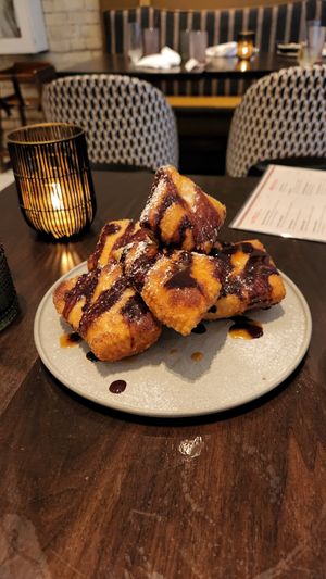 Some kind of amazing fried donuts dessert at PLANTA Cocina in Toronto
