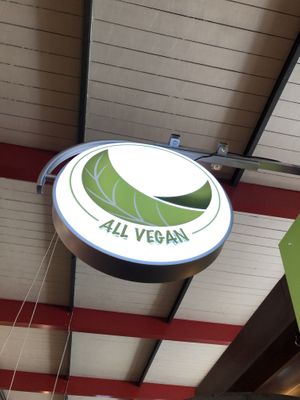 Pictured is the restaurant sign  at All Vegan in Hannover