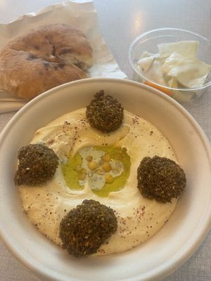 Falafel-hummus bowl with pickled veggies and pita bread  at Levantini in Maastricht