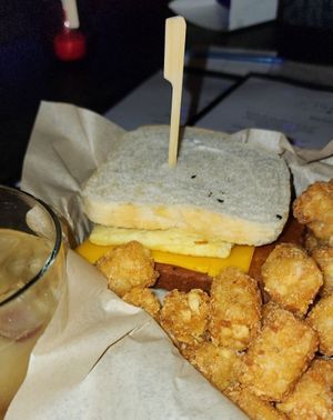 Breakfast sandwich with tots. at Infinity Room in Salem