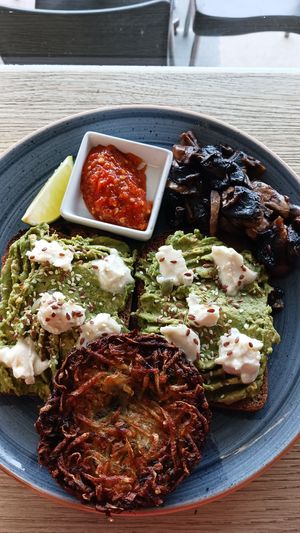 Smashed avo with vegan feta, I added mushies and rosti, all for $25. They no longer do the Asian salad with spring rolls. I've also had the tofu burger which was delish! at Earthbound Bowra in Nambucca Heads