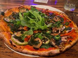 The vegetarian pizza minus mozzarella with added arugula, jalapeño and capers. at La Leyenda de L'Antico Forno in Puerto Viejo De Talamanca
