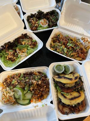 overview of the feast! indonesian lettuce wraps, arepas, fried rice + mac & curls at Planted PDX in Portland