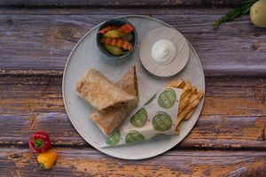 Vegan Shawarma
Saj bread, garlic sauce, tomatoes, lettuce, and pickles, with Vegan Plant-Based meat.
 at Just Vegan - Marina Walk Pearl in Dubai