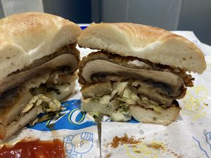 Sesame bagel, Katsu portobello, pineapple, cabbage, tartar sauce  at 404Plant in Hong Kong Island