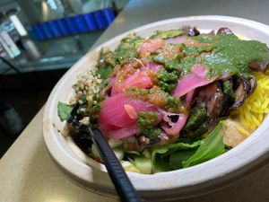 Build-a-Bowl: Mushroom, Greens, Spicy Hummus, Tabbouleh, Seasoned Rice, Pickled Onions, Cucumber & Tomato, Sautéed Vegetables, Roasted Eggplant Spread, Red & Cilantro Sauce at DEN - Garbanzo Mediterranean Fresh - TB in Denver