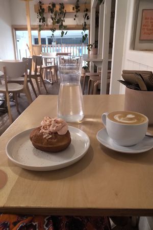 Coconut berry buttercream donut & latte on oat! at Plant Vibes Cafe in Bowen Hills