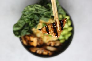 Teriyaki tofu bowl served with vegan egg fried rice, edamame and greens.  at Foodbae in Kuala Lumpur