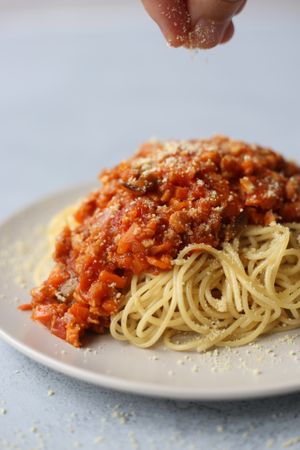 Spaghetti bolognese topped with vegan parmesan.  at Foodbae in Kuala Lumpur