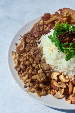Overnight marinated juicy jackfruit served with basmati rice steamed with raisins, mix vegetables briyani sauce and crispy cashews, topped with a mix of mint-coriander leaves at Foodbae in Kuala Lumpur