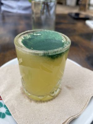 Ginger shot with spirulina  at Racó Verd in Ibiza