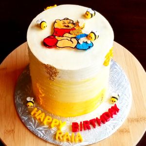 Pooh bear themed cake  at Petit Gateau in Victoria