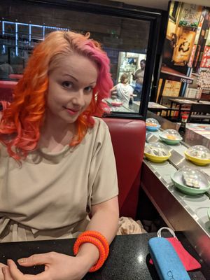 Dishes going round on the sushi belt at Sakushi in Sheffield