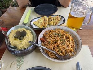 Vegan fava “married” dip and garlic and tomato pasta (skordomakarona)  at Pelican Kipos in Santorini