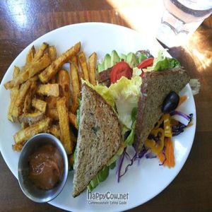 tempeh, lettuce & tomato sandwich w avocado & sweet potato fries at McFoster's Natural Kind Cafe in Omaha