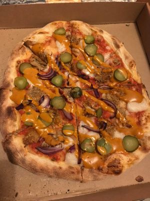 The Big Jack: A full-on pizza-burg: Crispy Fried Jackfruit chickn, tomato sauce, mozzarisella, red onion and gherkins, all smothered in our top secret burger sauce. at Biff's Plant-based Pizza & Wingz in Southampton