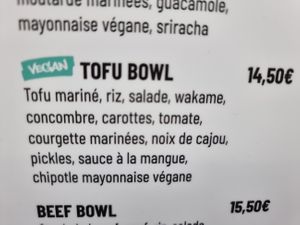 vegan options clearly labeled on menu at Simbiosa in Luxembourg City