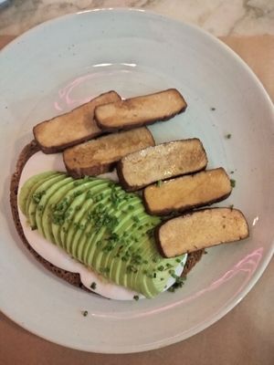Avocado toast with delicious tofu. at Niki Athens Hotel in Athens