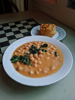 Chickpea stew with a cinnamon roll at Abeille Voyante Tea Co in Millvale