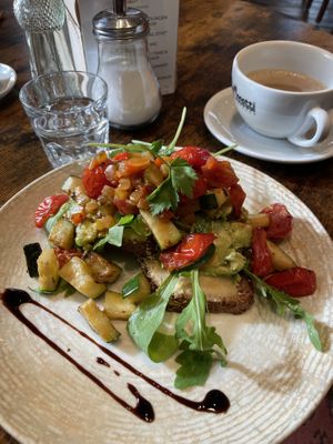toast with hummus, avocado, rocket, tomatoes and courgette and oat cappuccino   at Café Lebenslust in Rothenburg Ob Der Tauber