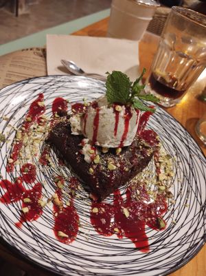 Brownie with coconut icecream, pistachios and fruit coulis. Very tasty and good combo at MESTIZA in Valencia