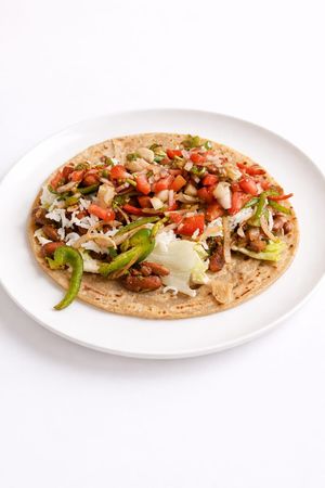 Wholesome Wrap - In-house- whole-wheat or gluten-free flour wrap, all sauces and wrap fillings, creamy oil-free spread instead of mayonnaise, topped with fresh raw veggies,  at Tralata in Mumbai