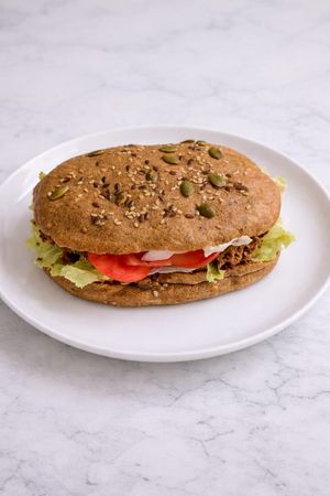 Loaded Besan Panini Sandwich - Everything made in-house. Lentil bread made with no wheat or rice, oil-free spread instead of mayo, chickpea pancake made to order, raw veggies at Tralata in Mumbai