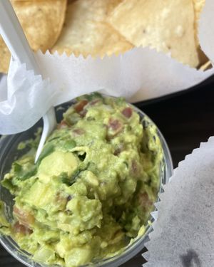 Tasty guac, but chips are extra.   at Hamburguesas El Gordo in St Paul