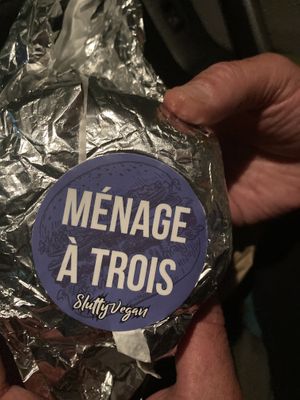 Vegan burger loaded with vegan bacon, shrimp, cheese, caramelized onions, lettuce, tomato, and slut sauce  at Slutty Vegan - Edgewood in Atlanta