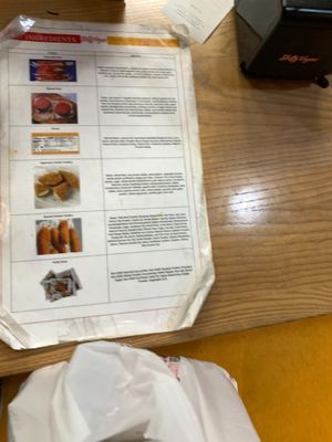 Ingredient info sheet taped to ordering counter

 at Slutty Vegan - Edgewood in Atlanta