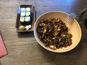 Crispy Brussels sprouts and mini avocado roll. at Kitchen 121 in Duluth