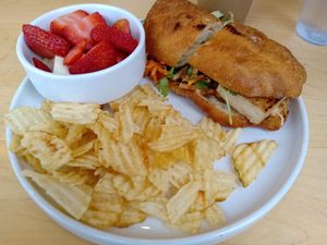 Banh mi with side order of fruit at Melo Coffee & Kitchen in Rochester