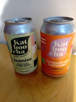 Two cans of Katboocha (Jasmine and Grapefruit Lavender) at Melo Coffee & Kitchen in Rochester