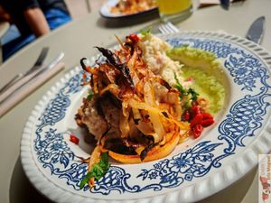 MoMos : Charred white cabbage with walnut oil, cauliflower and chickpea msabbaha with tahini, sunflower crumble and sourdough bread, green sauce and goji berries at Café Augustin in Rouen