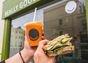 Sandwich and juice outside Really Good Juice - picture from an article at Really Good Juice in Hove