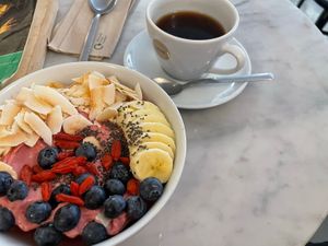 Raspberry bowl and coffee   at Love Juice Bar - Grenelle in Paris