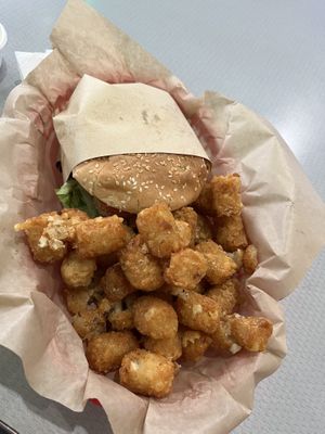 Spicy chicken sandwich and tater tots    at Nice Burger - Santa Ana in Santa Ana