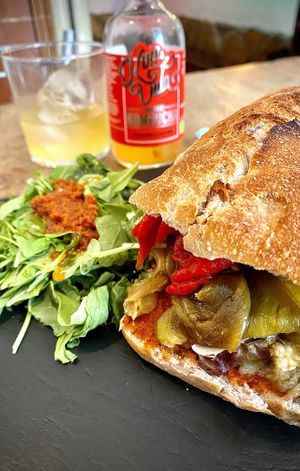 “Chapata pura vida” Sandwich and carrot/turmeric kombucha.  at Santa y Pura in Madrid