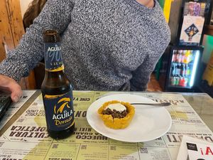 Tapapies 2023: Corn flour casing filled with meat and topped with a creamy white sauce. at Santa y Pura in Madrid