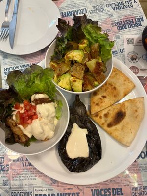Special starter (15,50€) with two warm salads (spicy potato-avocado and fried cauliflower with tahini) and deconstructed baba ganoush. at Santa y Pura in Madrid