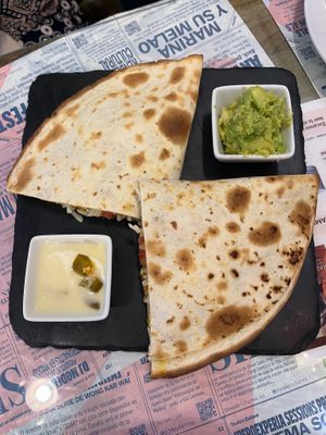 Quesadilla (11€) with avocado and jalapeño cheese. at Santa y Pura in Madrid