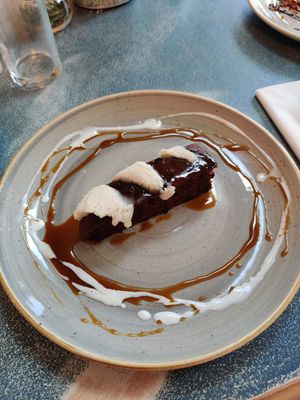 Chocolate brownie with ice cream at Harp & Crown in Corsham